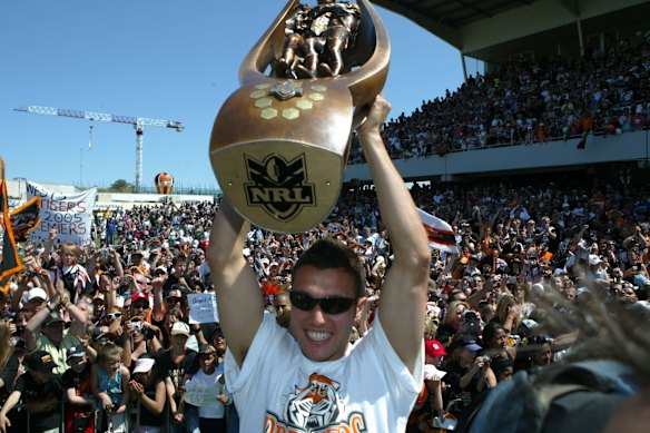 Scott Prince celebrates with the NRL trophy in 2005.