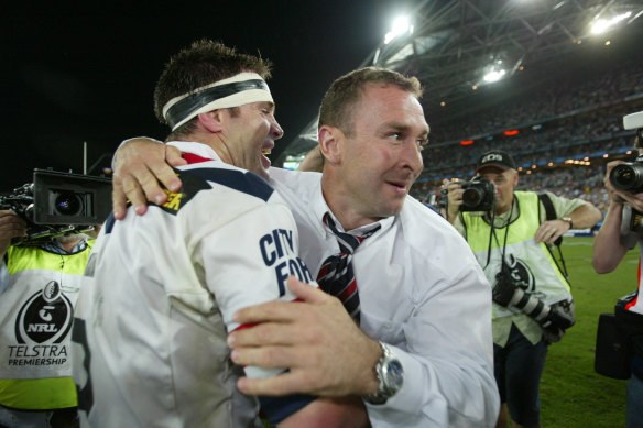 Ricky Stuart celebrates with Brad Fittler after winning a title in his first season as a coach with the Rooster in 2002.