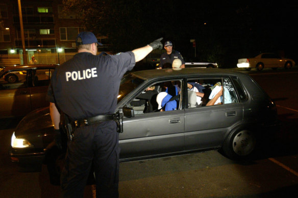 Police stop and check cars on December 12, 2005, a day after the Cronulla riot.