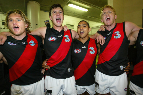 James Hird, David Hille, Damien Cupido and Dustin Fletcher sing the song after Essendon’s most recent finals win in 2004.