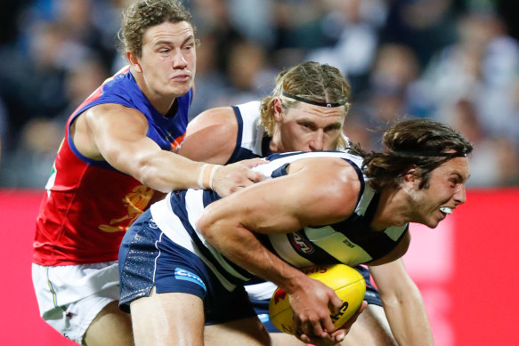 Geelong’s Jack Henry is tackled on Friday night.