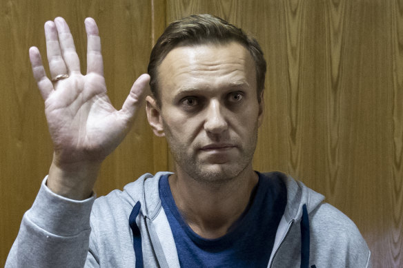 Russian opposition leader Alexei Navalny gestures in a court room in Moscow.