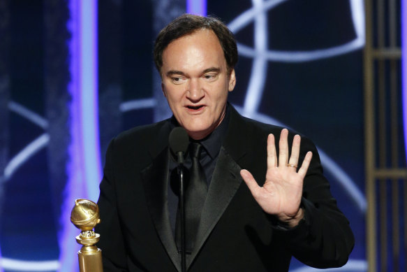 Quentin Tarantino accepts the award for best screenplay for Once Upon a Time...in Hollywood.