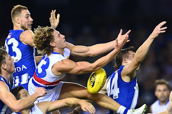 Western Bulldogs forward Aaron Naughton goes for a mark.