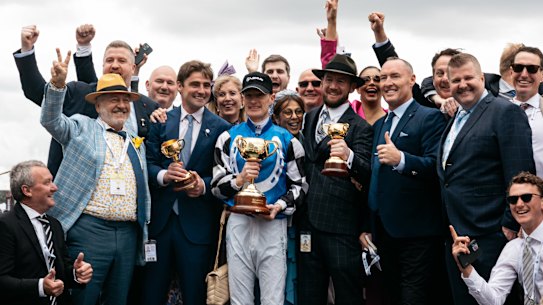 The owners of Gold Trip celebrate with winning jockey Mark Zahra