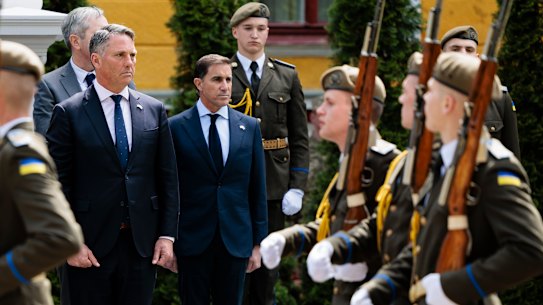 Defence Minister Richard Marles (left) and Chief of Army Lieutenant General Simon Stuart at a ceremony for fallen Ukrainian soliders at the National Army Academy in Lviv on Saturday. 