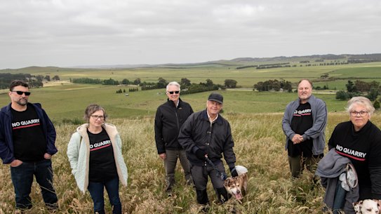 Mitchell Shire councillor Rob Eldridge (third left) with locals (from left) James Cisco, Skye Forster, Mike Phillips, Gazza Sturdy and Gayle Phillips on Green Hill in Wallan. Spring Hill and the proposed quarry site is in the background.