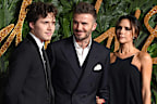 Brooklyn Beckham, David Beckham and Victoria Beckham, pictured in 2018.