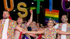 MinterEllison's lawyers dance in Mardi Gras with a justice-themed float.
