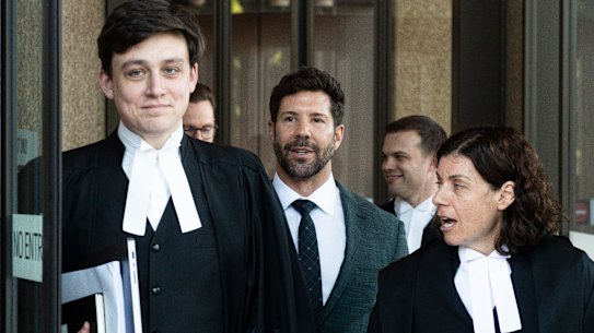 Heston Russell, centre, flanked by his barristers Nicholas Olson (left) and Sue Chrysanthou, SC, (right) on Tuesday.