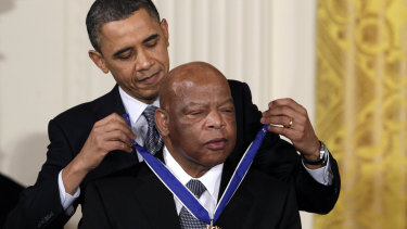 Then US President Barack Obama presents a 2010 Presidential Medal of Freedom to Democrat Congressman John Lewis, who died in July 2020.