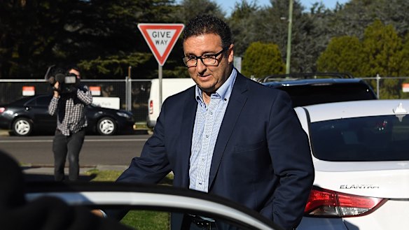 Shaoquett Moselmane leaves his Rockdale home on the day of the raids.