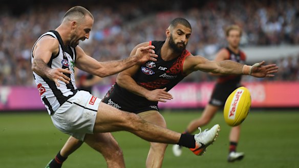 Steele Sidebottom (left) and Essendon's Adam Saad on Anzac Day.