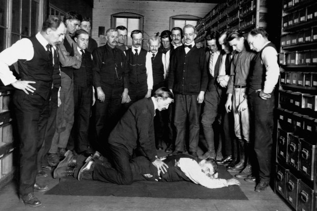 A demonstration of artificial respiration to workers at the Chesapeake & Potomac Telephone Company in Washington DC in 1922. 