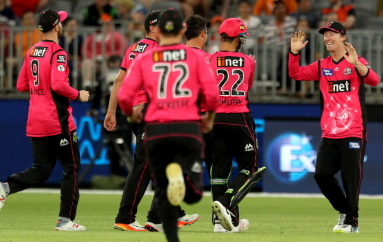 The Sixers celebrate the dismissal of Sam Whiteman, of the Scorchers.