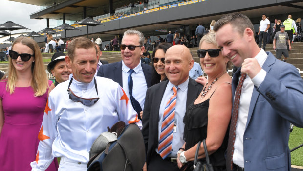 Co-trainer Adrian Bott, right, with jockey Hugh Bowman and connections after the Silver Slipper.