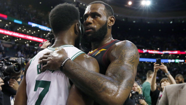 The Cavs' LeBron James embraces Boston's Jaylen Brown at the end of game seven.