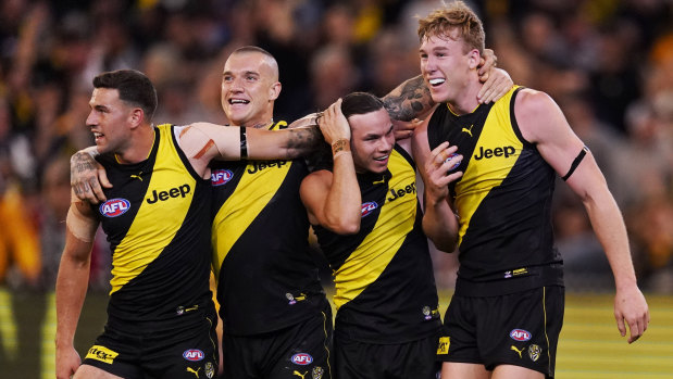 Jack Graham, Dustin Martin, Daniel Rioli and Tom Lynch celebrate the win.