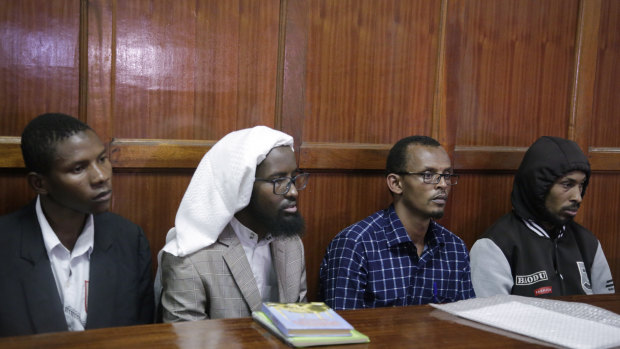 From left to right, defendants Rashid Charles Mberesero, Sahal Diriye Hussein, Hassan Aden Hassan and Mohamed Abdi Abikar, sit in the dock.