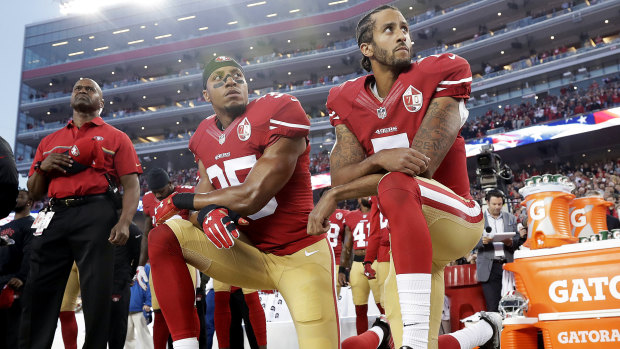 Kaepernick (right) has not played in the NFL since 2016 but his jersey remains among the league's best sellers.