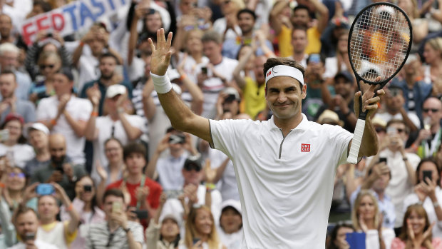 Familiar march: Federer celebrates after beating Lucas Pouile on day six at Wimbledon.