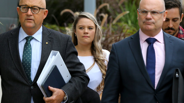 Amy Crisp (centre) arrives for the inquest into the Dreamworld disaster at the Magistrates Court at Southport.