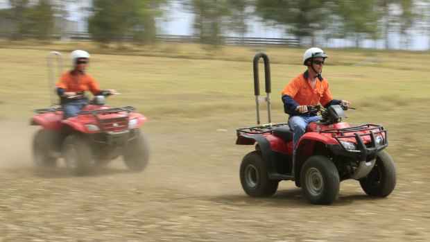 School students are shown how to ride a quad bike safely.