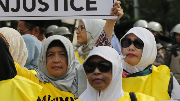 Supporters of losing presidential candidate Prabowo Subianto display posters during a rally near the Constitutional Court in Jakarta last week.