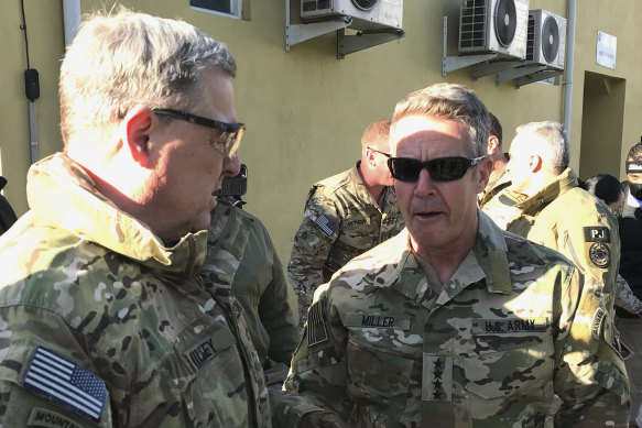 The  chairman of the US Joint Chiefs of Staff, General Mark Milley (left), talks with General Scott Miller, the commander of US and coalition forces in Afghanistan, last month.