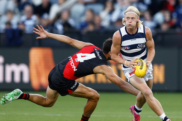 Oliver Dempsey evades Kyle Langford.