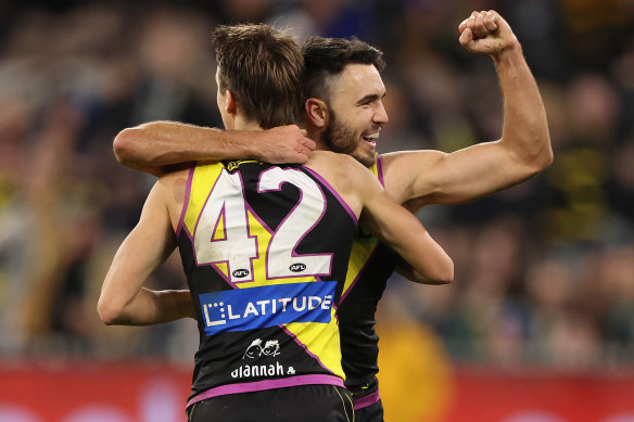 Shane Edwards celebrates a goal with Judson Clarke.