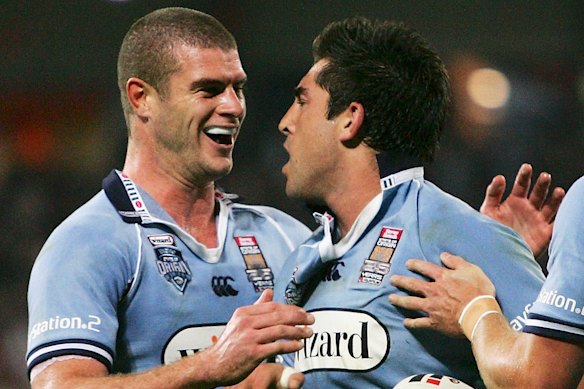 King celebrates a try with Braith Anasta during NSW’s game three victory at Suncorp Stadium in 2005.