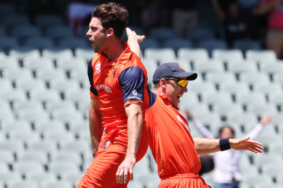 The Netherlands’ Brandon Glover and Logan van Beck celebrate a South African wicket.