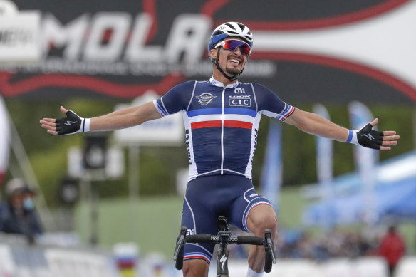 Julian Alaphilippe celebrates as he crosses the line. 