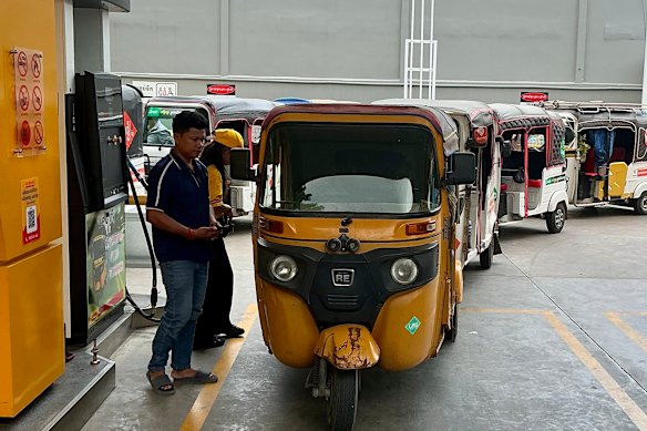 Tuktuk drivers at a fuel station in Phnom Penh. Prices for LPG have doubled since the outbreak of war in the Middle East.