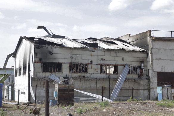 In this photo taken from video a view of a destroyed barrack at a prison in Olenivka, in an area controlled by Russian-backed separatist forces.