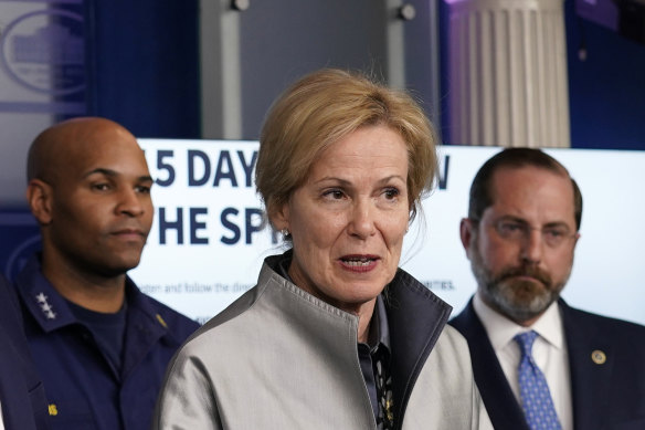 Dr Deborah Birx, centre, has called out some younger people for not taking the coronavirus pandemic seriously enough.