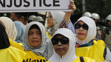 Supporters of losing presidential candidate Prabowo Subianto display posters during a rally near the Constitutional Court in Jakarta last week.