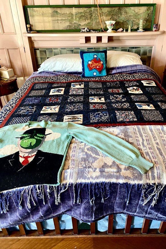 Martin Sharp's bed surrounded by a mix of bourgeois china ornaments and eclectic pop art.