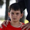 Oscar Loebenstein, 10, poses for a portrait at Heffron Park.