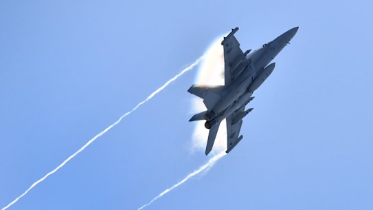 A Royal Australian Air Force EA-18G Growler flies over the Brisbane skyline as part of their final rehearsal for Riverfire in Brisbane, Friday, September 28, 2018.  More than half a million people will watch Riverfire, which involves 20 minutes of fireworks along the CBD reach of the Brisbane River and displays of Australian Air Force jets. (AAP Image/Darren England) NO ARCHIVING