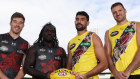 Zach Merrett and Anthony McDonald-Tipungwuti of the Bombers and Marlion Pickett and Toby Nankervis of the Tigers pose during the Dreamtime at the ’G Game at Melbourne Cricket Ground on Thursday.