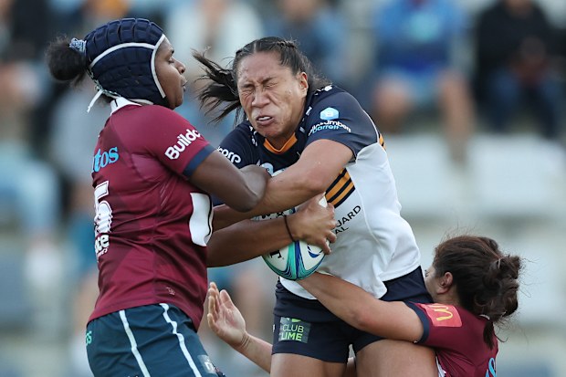 Siokapesi Palu of the Brumbies is tackled at Concord Oval.