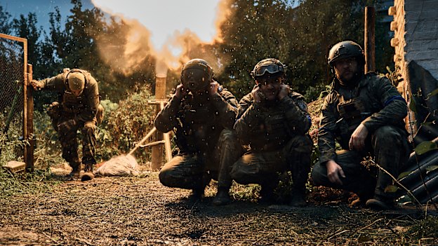 Ukrainian soldiers fire in the recently retaken Kupiansk in the Kharkiv region, Ukraine.