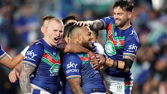 The Warriors celebrate their second try.