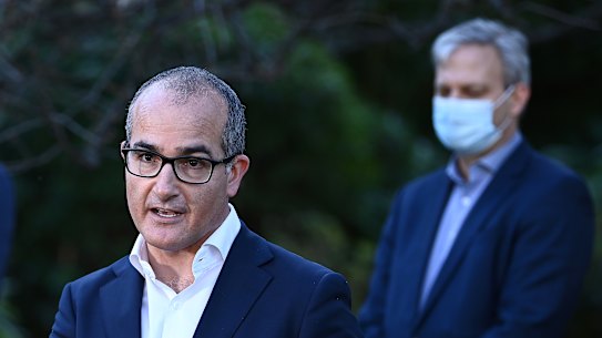 Victoria’s acting Premier, James Merlino, centre, has levelled blame for the state’s latest outbreak on the federal government.