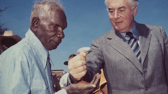 Prime Minister Gough Whitlam pours soil into the  hand of traditional landowner Vincent Lingiari, Northern Territory in 1975.
