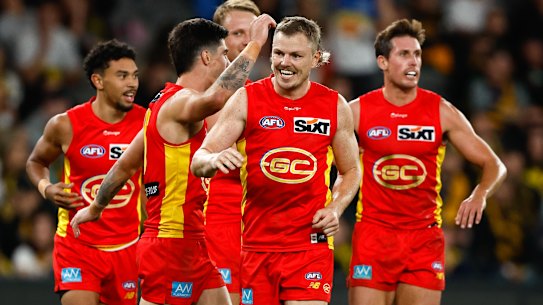 MELBOURNE, AUSTRALIA - APRIL 30: Nick Holman of the Suns celebrates a goal during the 2023 AFL Round 07 match between the Richmond Tigers and the Gold Coast Suns at Marvel Stadium on April 30, 2023 in Melbourne, Australia. (Photo by Dylan Burns/AFL Photos via Getty Images)