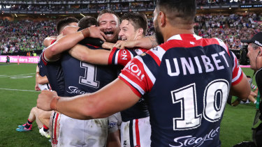 The Roosters celebrate back-to-back grand final wins after a controversial defeat of the Raiders.