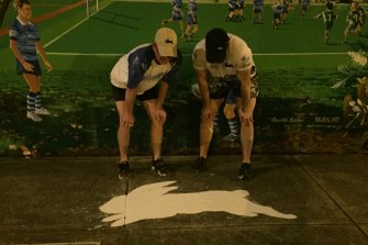 The South Sydney Rabbitohs logo which is popping up around town after dark.